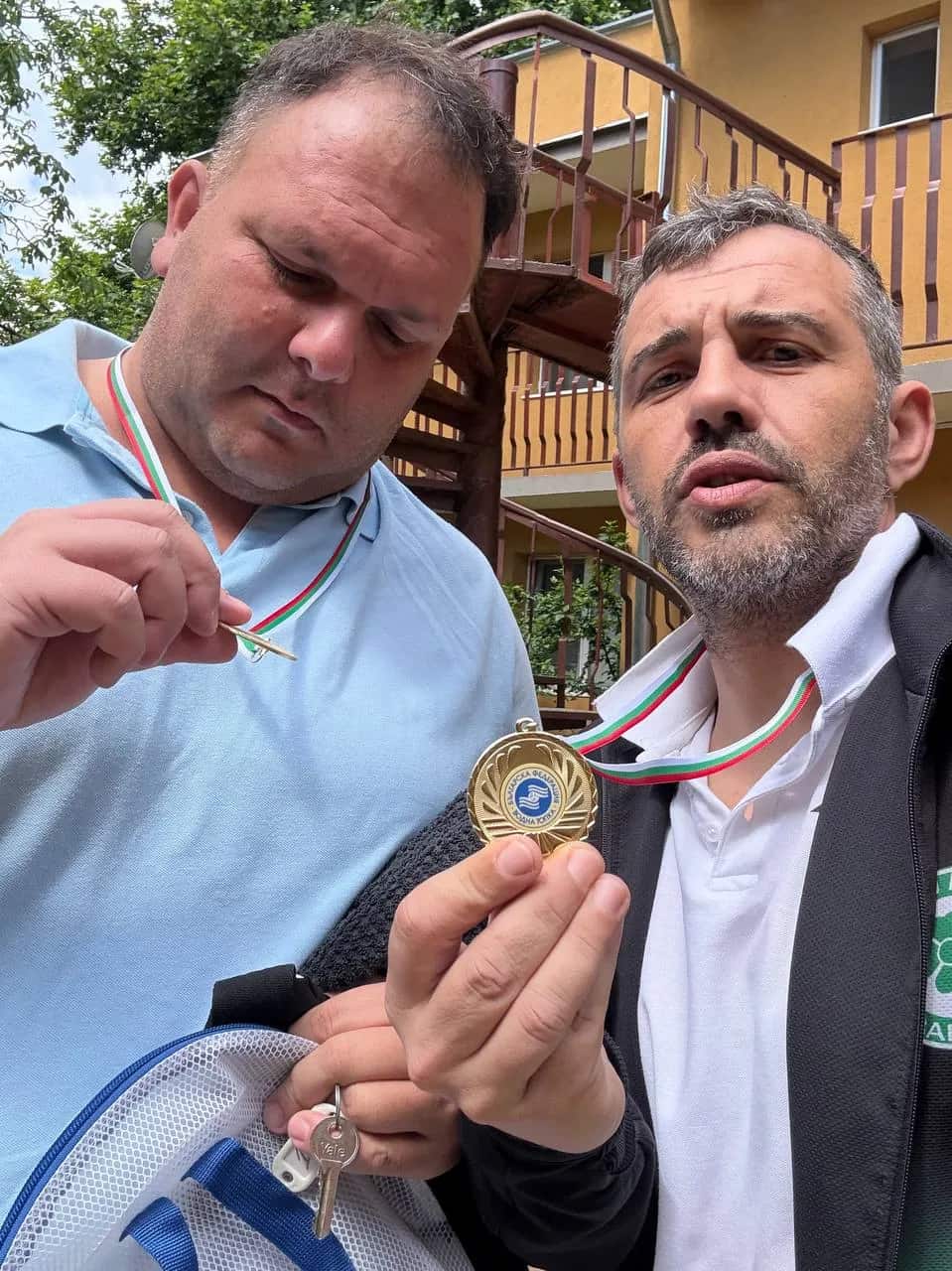 Two of the squad show their medals, Division 2