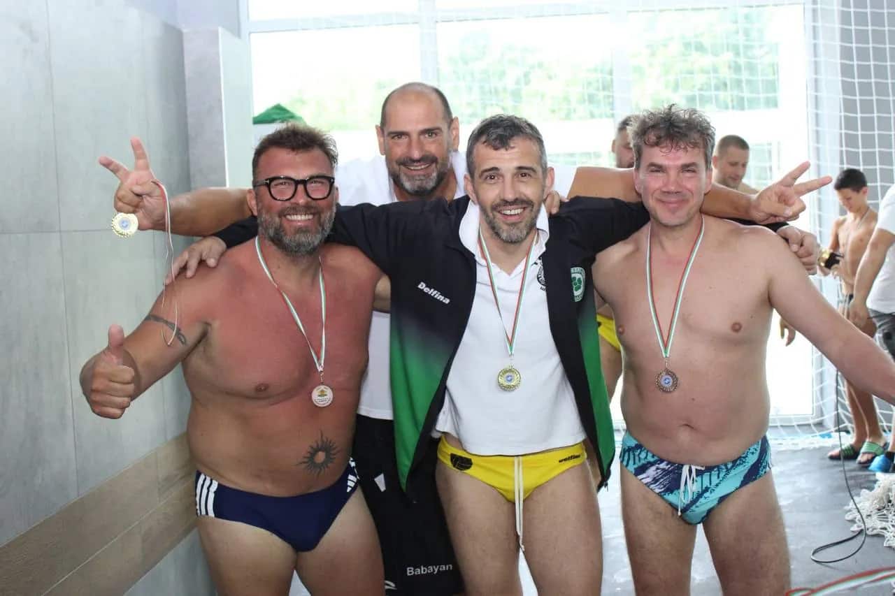 Three of the squad with their medals, Division 2