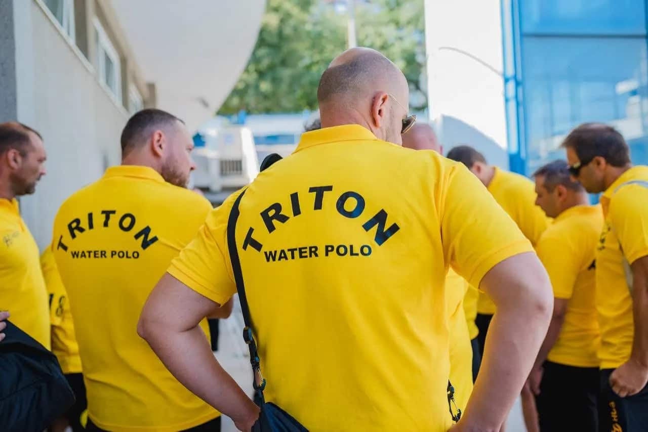 The team in yellow TRITON Water Polo polos before a match