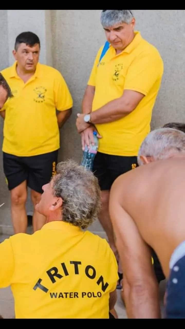 A talk before a match — the back of a TRITON Water Polo polo